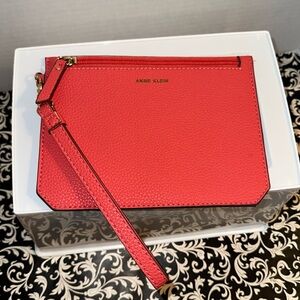 Anne Klein Wristlet coral/orange color Gold Zipper and lettering NWOT
